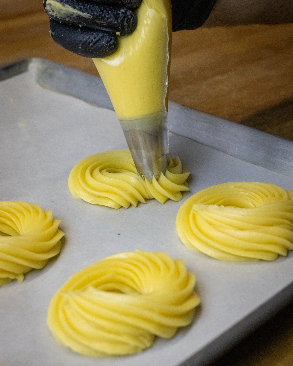 The process of making zeppole pastries.
